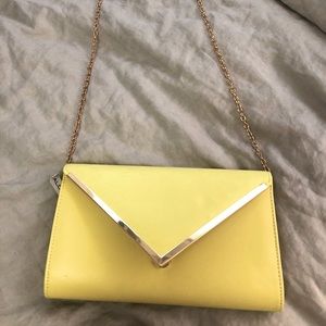 Yellow clutch with a long chain